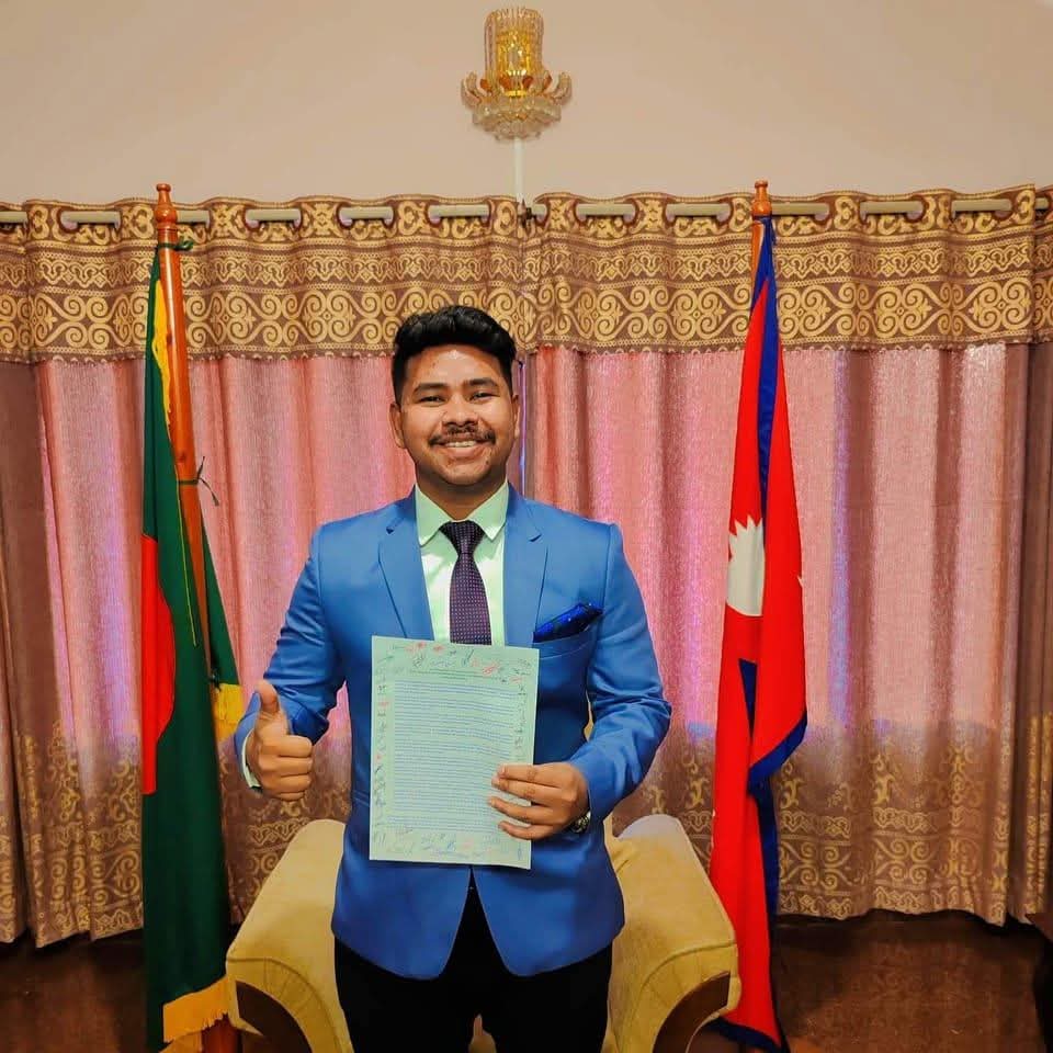 Sohag An Nafis in blue suit with document